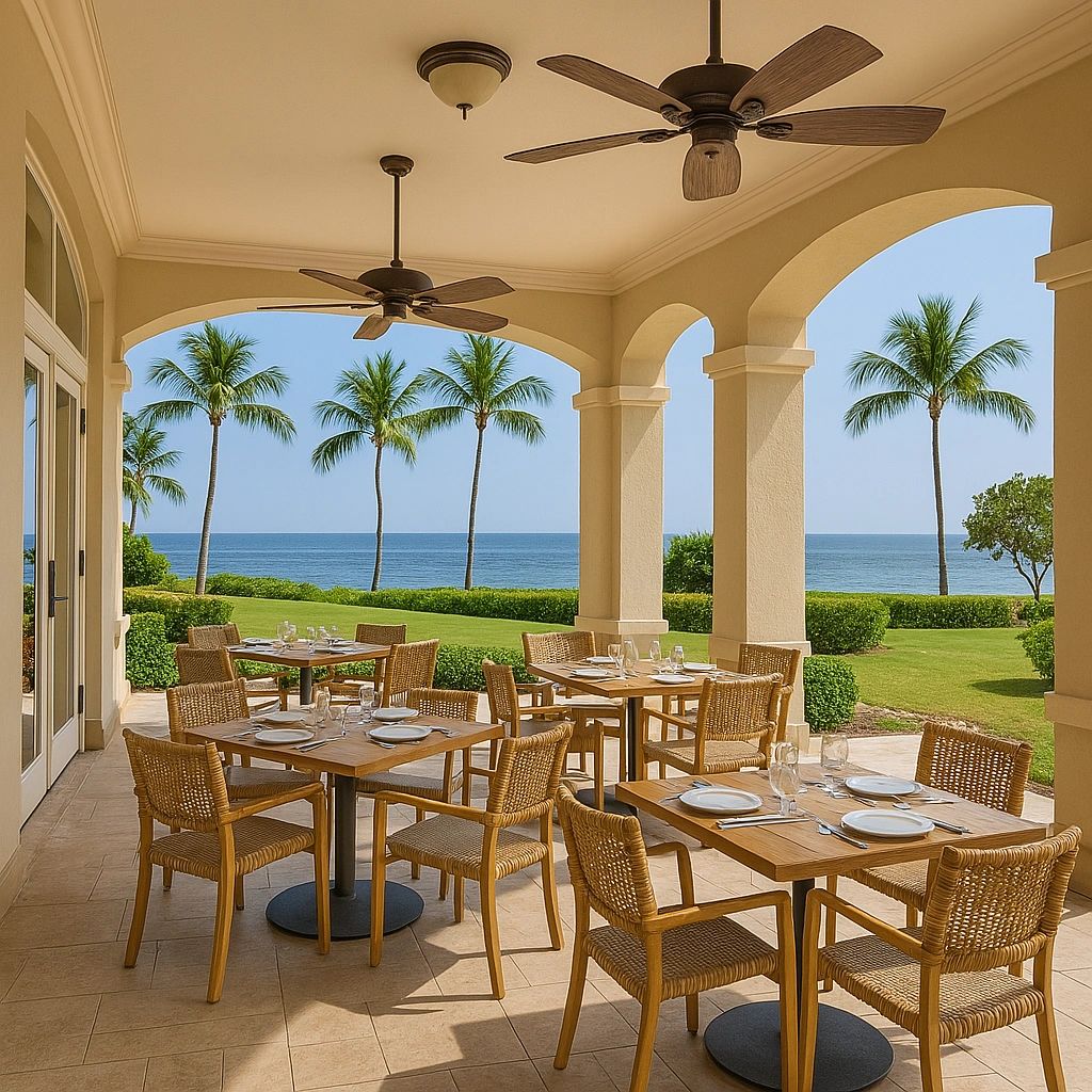Open-air resort restaurant overlooking palm trees and the ocean